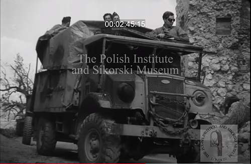 Need your help for identify soldier on photo (inside truck)