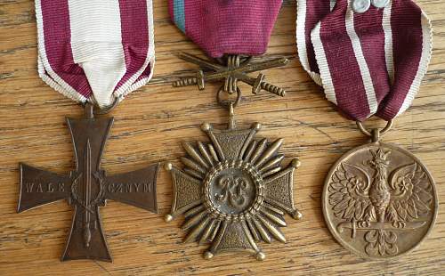 A group with a sand cast Merit Cross