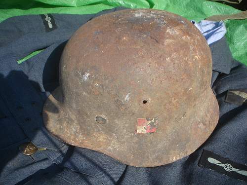 German Helmet with Polish Emblem on it ?