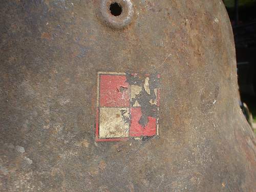 German Helmet with Polish Emblem on it ?