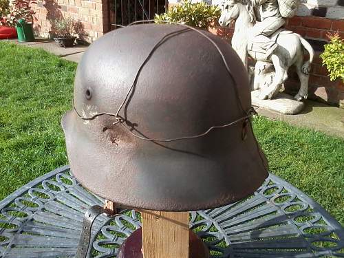 battle-damaged SD M40 helmet