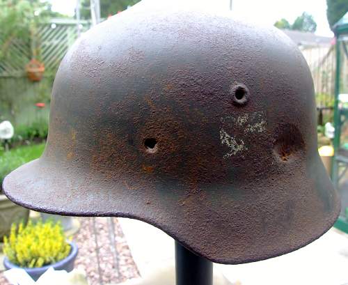 battle-damaged SD M40 helmet