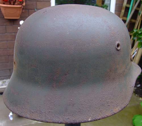 battle-damaged SD M40 helmet