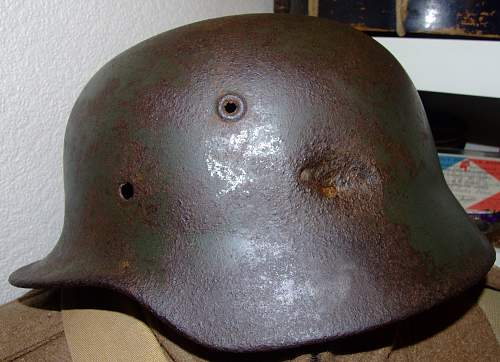 battle-damaged SD M40 helmet