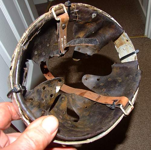 battle-damaged SD M40 helmet