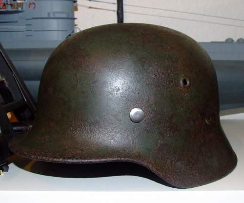 battle-damaged SD M40 helmet