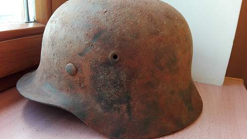 German helmet with the name of the soldier written on the leather