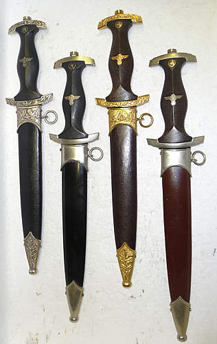 Four reproduction daggers