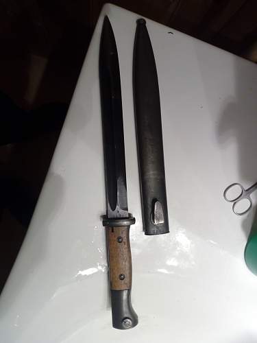 K98 bayonet with strange numbers on scabbard and handle.