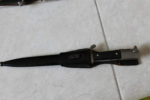 Short  Military bayonet with red insert, please help to ID