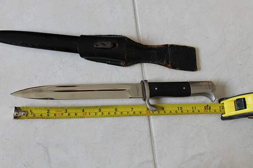 Short  Military bayonet with red insert, please help to ID