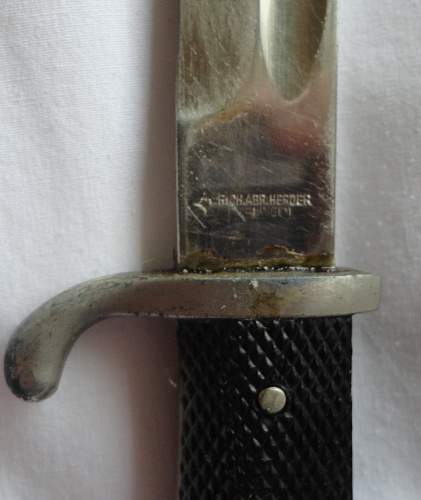 Short  Military bayonet with red insert, please help to ID