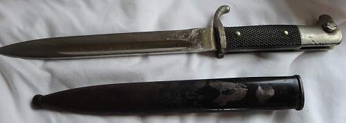 Short  Military bayonet with red insert, please help to ID