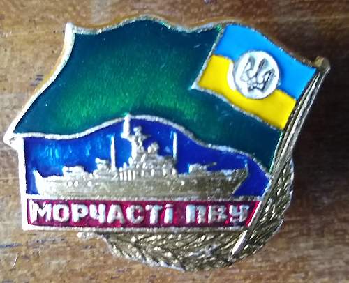 Russian submarine and Ukraine Sea Guard badges