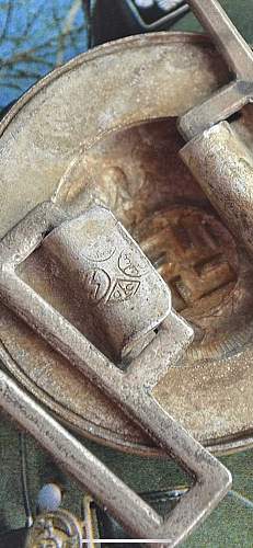 This buckle is stamped with Schutzstaffel, Is it the real deal? it has alot of patina and age.