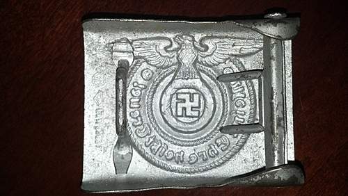 Have an SS Belt Buckle, Aluminum. Marked Well but I've had it in my repro pile for 2 years. Want to get a second opinion!