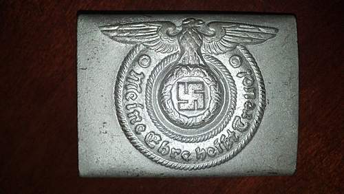 Have an SS Belt Buckle, Aluminum. Marked Well but I've had it in my repro pile for 2 years. Want to get a second opinion!