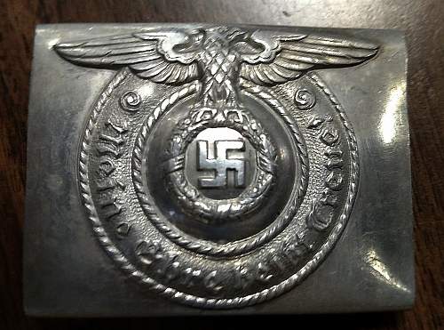 Have an SS Belt Buckle, Aluminum. Marked Well but I've had it in my repro pile for 2 years. Want to get a second opinion!