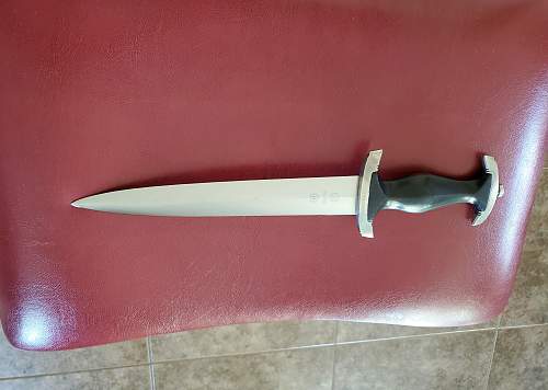 Before/After photos of cleaned dagger blade