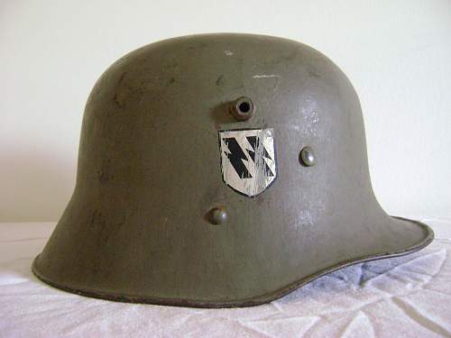 Help in identification and authenticity. SS and swastika green helmet