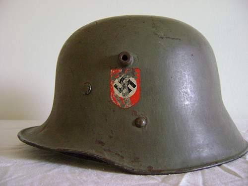 Help in identification and authenticity. SS and swastika green helmet