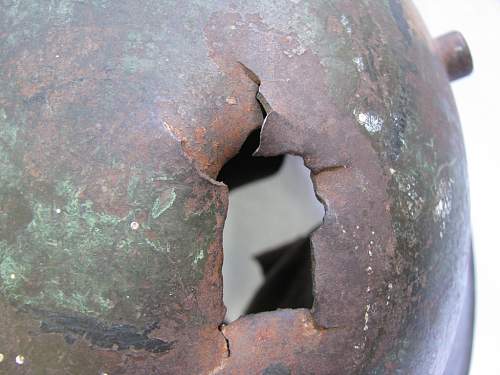 SS helmet with battle damage - Need help if legit or not