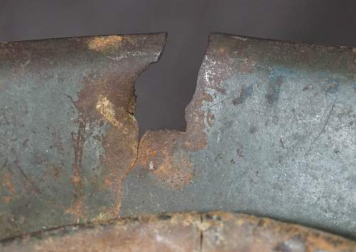 Combat damaged M42 SS helmet