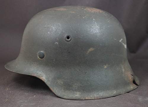 Combat damaged M42 SS helmet