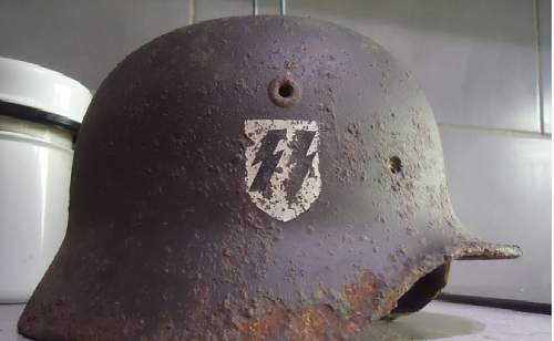 SS helmet with at least a fake swastika decal ?