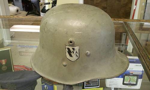 Help in identification and authenticity. SS and swastika green helmet