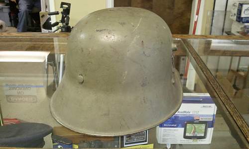 Help in identification and authenticity. SS and swastika green helmet