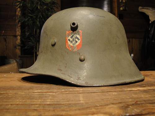 Help in identification and authenticity. SS and swastika green helmet