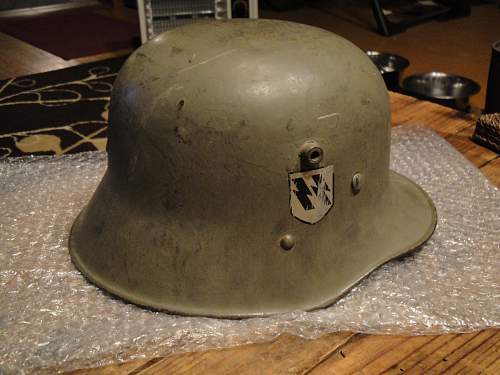 Help in identification and authenticity. SS and swastika green helmet