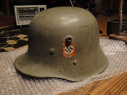 Help in identification and authenticity. SS and swastika green helmet