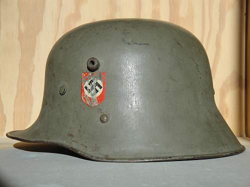 Help in identification and authenticity. SS and swastika green helmet