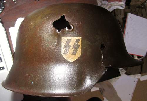 Looking for Opinions on My Battle-Damaged M42 SS Helmet