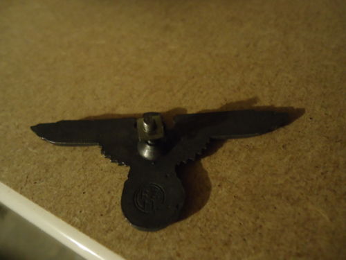 Is this a original SS metal cap insignia eagle and skull ?