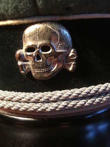 Is this a original SS metal cap insignia eagle and skull ?