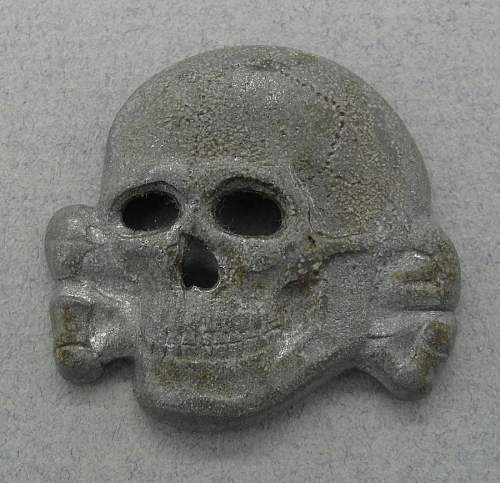 Is this a original SS metal cap insignia eagle and skull ?