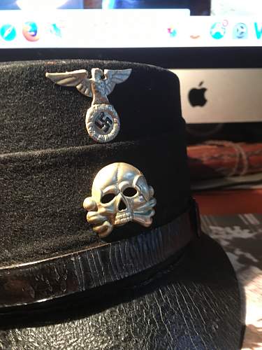 Is this a original SS metal cap insignia eagle and skull ?
