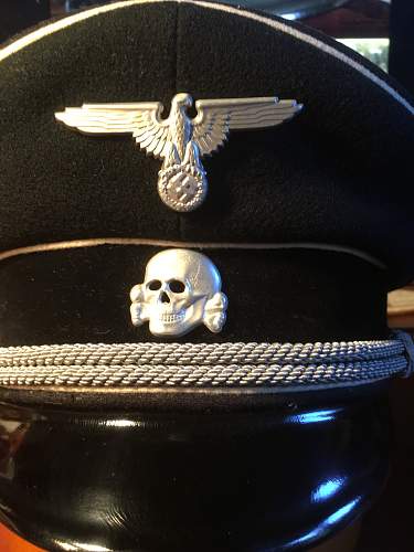 SS earlier cap insignia,worth more?