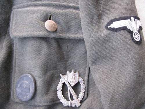 Waffen-SS late M44 model tunic for inspection.