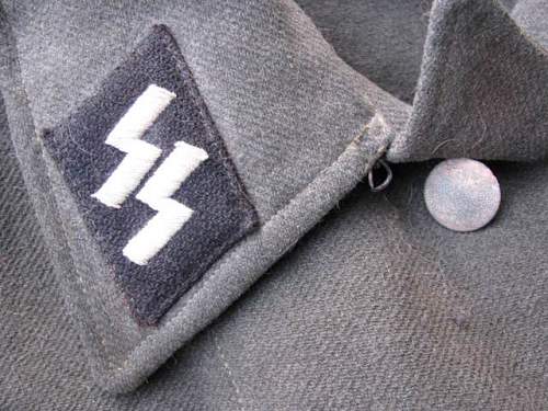 Waffen-SS late M44 model tunic for inspection.