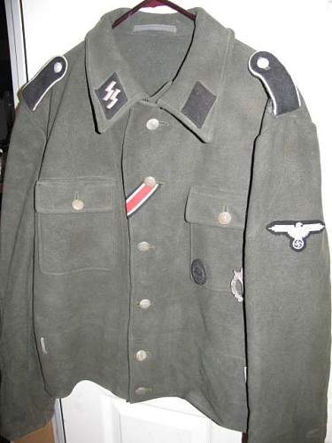 Waffen-SS late M44 model tunic for inspection.