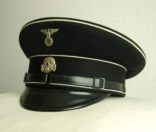 SS cap in Poland and its cousin