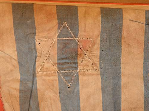 Kapo cut cloth insignia on blue and white cloth. Is it a fake ? Help please.