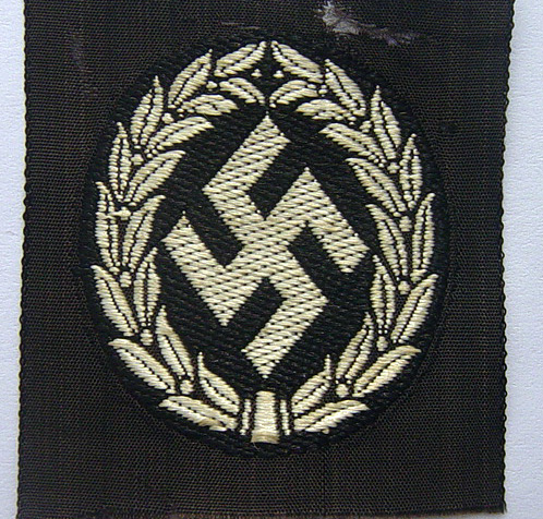 Schuma cap insignia