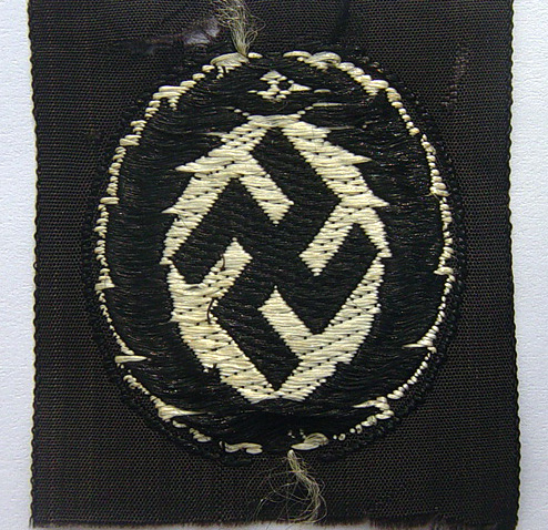 Schuma cap insignia