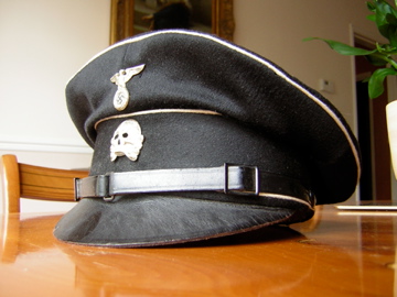 early black SS peaked cap: a study in contrasts.