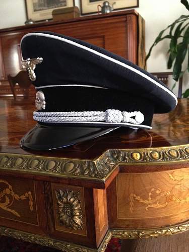 SS market in total rout:  black SS officer's cap sells for almost nothing in auction.